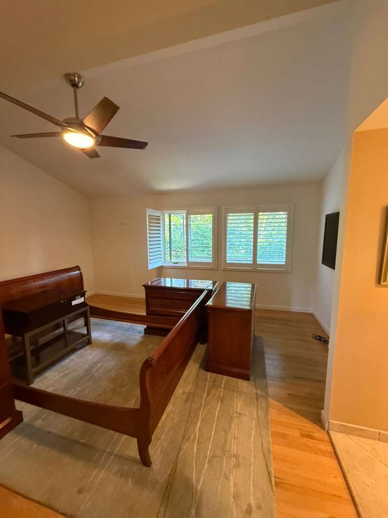 Large open interior with vaulted ceiling and freshly painted walls. Professional commercial-grade paint job